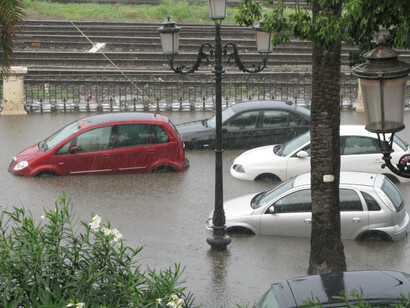 Flooded roads in Italy leave cars stranded while residents try desperately to escape the rushing waters