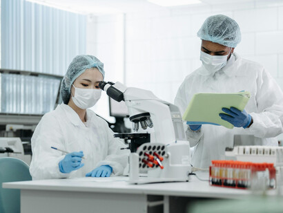 Scientists in a laboratory carefully conducting experiments and monitoring their findings