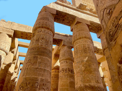 Ancient Egyptian hieroglyphs on the columns of Karnak Temple, Luxor, Egypt
