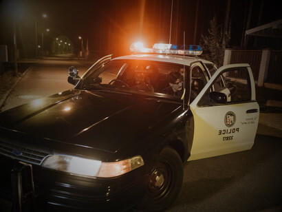 A police vehicle stationed near the crime scene