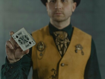 A magician handling cards with ease, hinting at how technique shapes outcomes