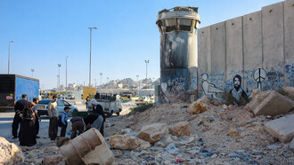 Monsieur Cana’s graffiti at the Qalandia checkpoint in Palestine