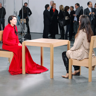In The Artist Is Present, performance artist Marina Abramović sat silently for over 700 hours at the Museum of Modern Art, inviting museum visitors to take a seat opposite her and engage in a nonverbal, deeply personal interaction. The performance became a cultural phenomenon, exploring themes of endurance, vulnerability, and the connection between an artist and her audience, USA