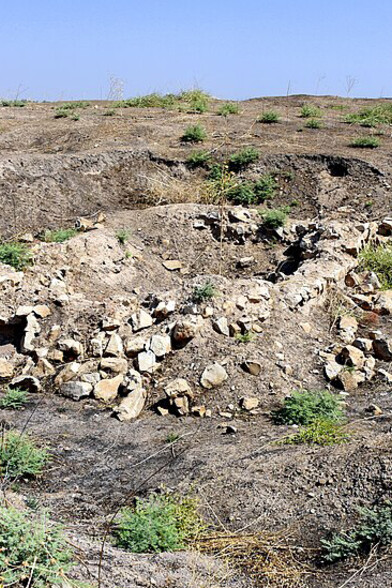 Yasin Tepe archaeological site featuring looters' pits, Sulaymaniyah Governorate, Iraqi Kurdistan