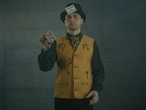 A magician getting ready for a card trick, hinting at how skill can hide bias
