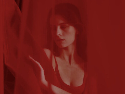 As she steps out from behind the curtain, she symbolises the journey towards breaking free from societal constraints and embracing true sexual empowerment