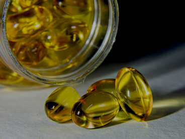 softgel vitamin capsules, emphasizing health and wellness supplements