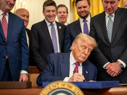 President Donald Trump signs S.1852, The GENIUS Act, Friday, July 18, 2025, in the East Room of the White House