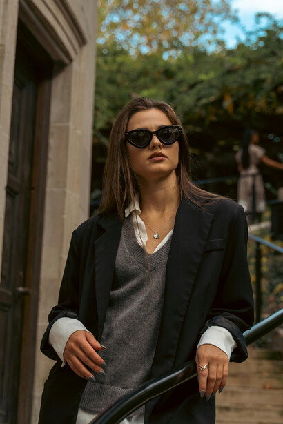 New York City, USA, a girl in an oversized blazer highlights the rise of gender-neutral and sustainable fashion