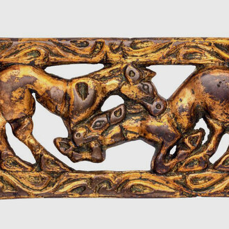Belt buckle depicting two fighting horses. Courtesy of The Museum of Fine Arts