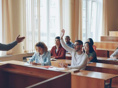 Students conversing and exchanging viewpoints, illustrating how the process can help them grasp difficult subjects more thoroughly and form a more balanced viewpoint on cybersecurity issues