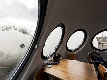 Bolwoningen is a cluster of 50 spherical houses located in the Maaspoort neighborhood of ’s‑Hertogenbosch, Netherlands, grouped together near a canal