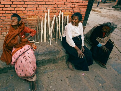 A group of homeless women on the streets, conveying the urgent need for just and inclusive housing solutions