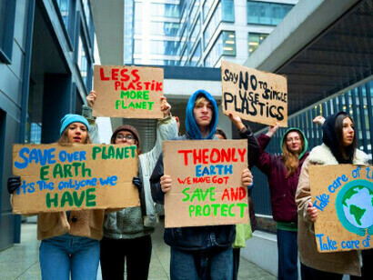 A just transition begins with decisive steps, illustrated by this crowd marching for a more equitable and sustainable future