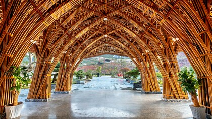 A bamboo structure with layered arches and joints, showing the fusion of traditional knowledge and modern engineering