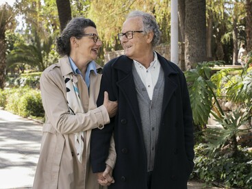 Surrounded by greenery, the couple breathes in cleaner air, filtered naturally by the trees lining the path