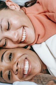 Two women making the choice to prioritize happiness 