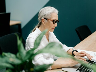 An employee focused and content at work, symbolising how ownership transforms jobs into long-term commitments