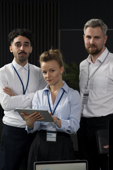 A collaborative team engaging with futuristic technology, exemplifying visionary leadership and the collective drive to innovate