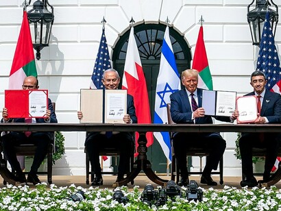 US President Donald J. Trump, Minister of Foreign Affairs of Bahrain Dr. Abdullatif bin Rashid Al-Zayani, Israeli Prime Minister Benjamin Netanyahu, and Minister of Foreign Affairs for the United Arab Emirates Abdullah bin Zayed Al Nahyan sign the Abraham Accords in 2020.
