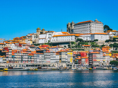 The Portuguese coast glowing under blue skies, reflecting how the final stop became the beginning of a new understanding