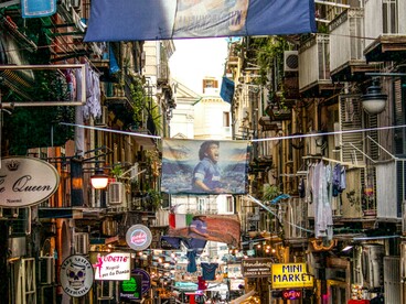 Lanterns and flags brighten the old town streets of Napoli, Campania, Italy