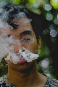Man inhaling smoke