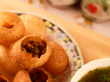 Gol gappa, India’s beloved street snack, elevated to a fine dining experience with refined plating on ceramic