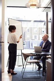 Sharing ideas and goals, a woman demonstrates the synergy between trusted allies in the professional world