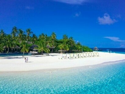 A bunch of huts near crystal-clear water, portraying that paradises like Tawi-Tawi help you disconnect from the world
