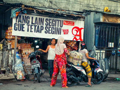 Pedestrians weave through the crowded streets of Jakarta, Indonesia, where the tantalising aromas of fresh vegetables, tempeh, and peanut dressing fill the air, offering a taste of the city's diverse cultural influences