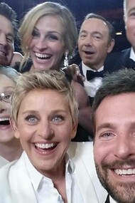 Celebrities posing for a selfie at the 2014 Oscar awards ceremony
