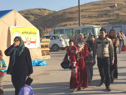 As fighting continues around Kobane and nearby parts of southern Syria, hundreds of Syrian families are arriving every day at the Ibrahim Khalil checkpoint on the Turkey–Iraq border, with more than 10,000 already having found sanctuary in the Kurdistan Region of Iraq since mid-September