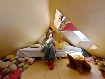 Spiral staircases lead to the rooftop units of Didden Village in Rotterdam, Netherlands, creating a unique connection between privacy and communal life