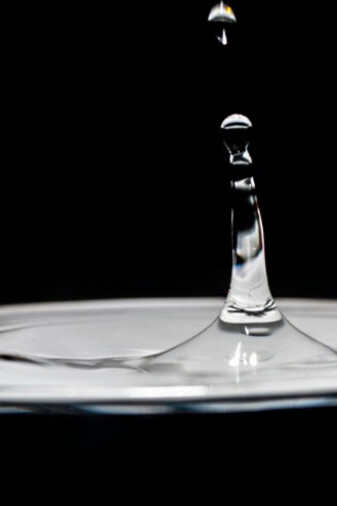A small water droplet captured in black and white