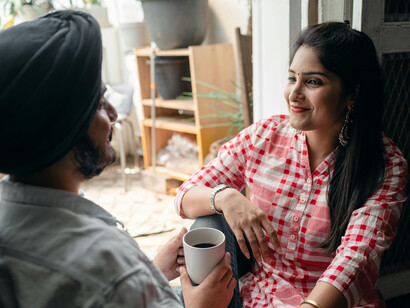  An Indian couple enjoys freshly brewed coffee at a café, embodying the new wave of café culture and conscious coffee consumption in India