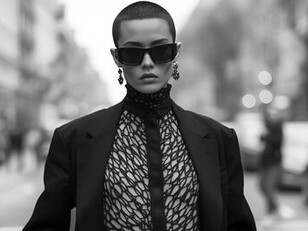 A street-style model embodies genderless fashion, dressed in a coat