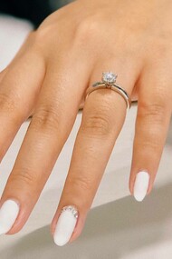 A woman recently engaged after accepting the proposal of her partner