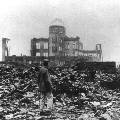 A man stands amid the ruins of Hiroshima after the United States dropped the atomic bomb on the city on August 6, 1945