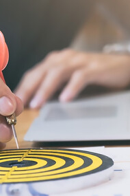 Business strategy success targets and goals illustrated on a dartboard