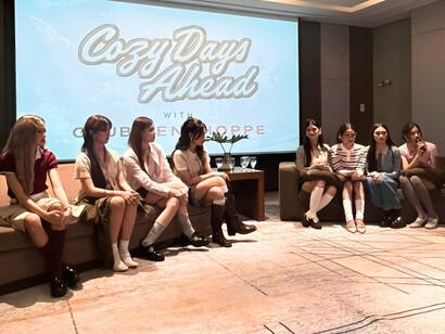 The group gathered in thoughtfully styled outfits, showing a pause for their simplicity to surface