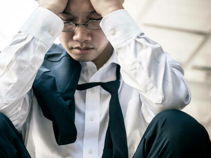 Struggling with anxiety and depression, an adult feels isolated and overwhelmed, weighed down by loneliness, fear, and the effects of racism and discrimination