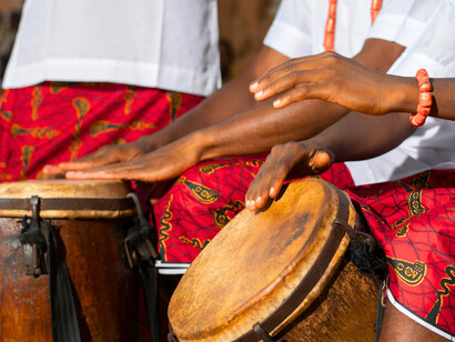 Some people performing with traditional drums, illustrating how culture continues to thrive even during times of religious tension