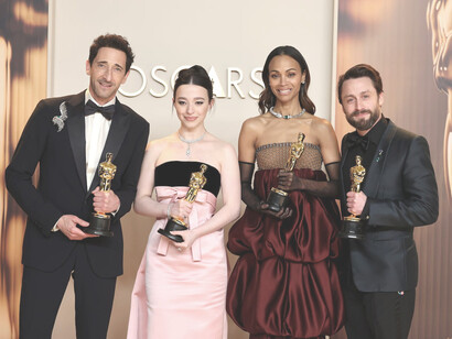 Amid the glitz and applause, winners take the stage, symbols of personal achievement in an institution increasingly out of step with the cultural moment