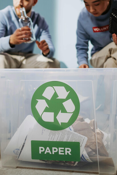 Sorting waste into designated bins, representing smart waste management
