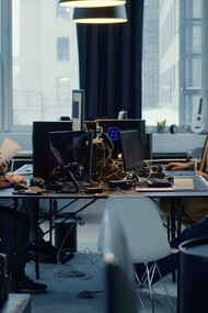 Focused and collaborative, the team navigates the complexities of developing an effective information system tailored to their evolving needs