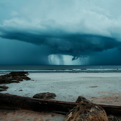 Storm clouds gathered over the sea as a cyclone unleashed its dark weather