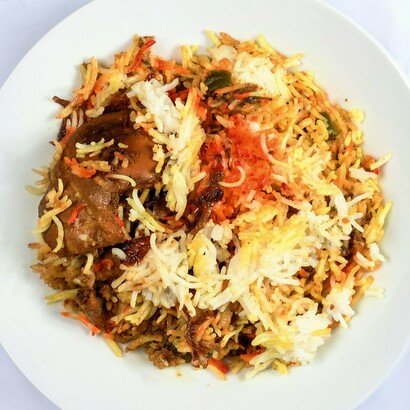 Nasi goreng, Southeast Asia’s beloved fried rice dish, combines humble leftover ingredients with rich flavors shaped by centuries of trade and cultural exchange