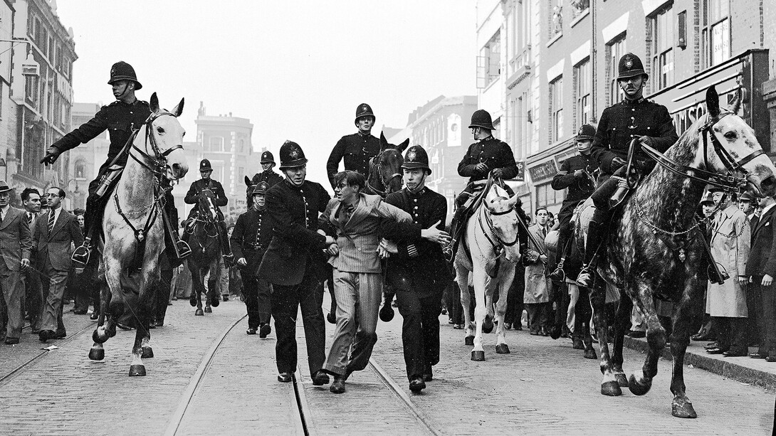 Eddie Worth, An anti-fascist demonstrator is taken away under arrest after a mounted baton charge during the Battle of Cable Street, London, 4, October 1936. Courtesy of the National Galleries of Scotland