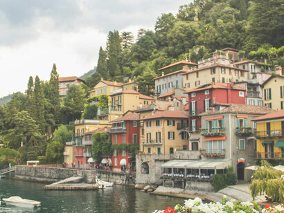 Colorful houses line the waterfront of Lake Como in Varenna, Lombardy, Italy